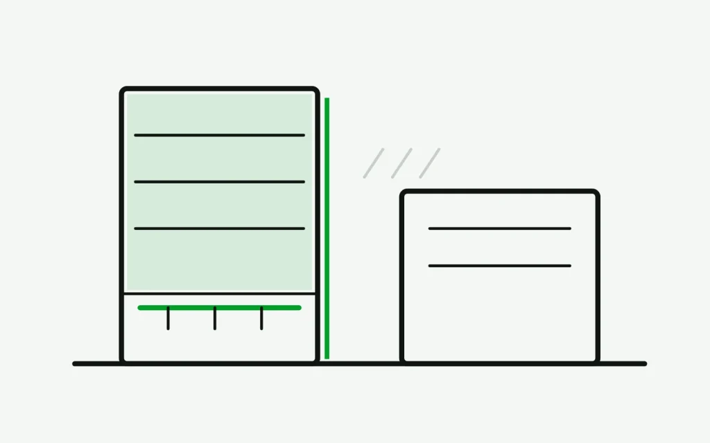 Reach-in cooler beside a hot cooking line, with its condenser grille and shelves drawn in section