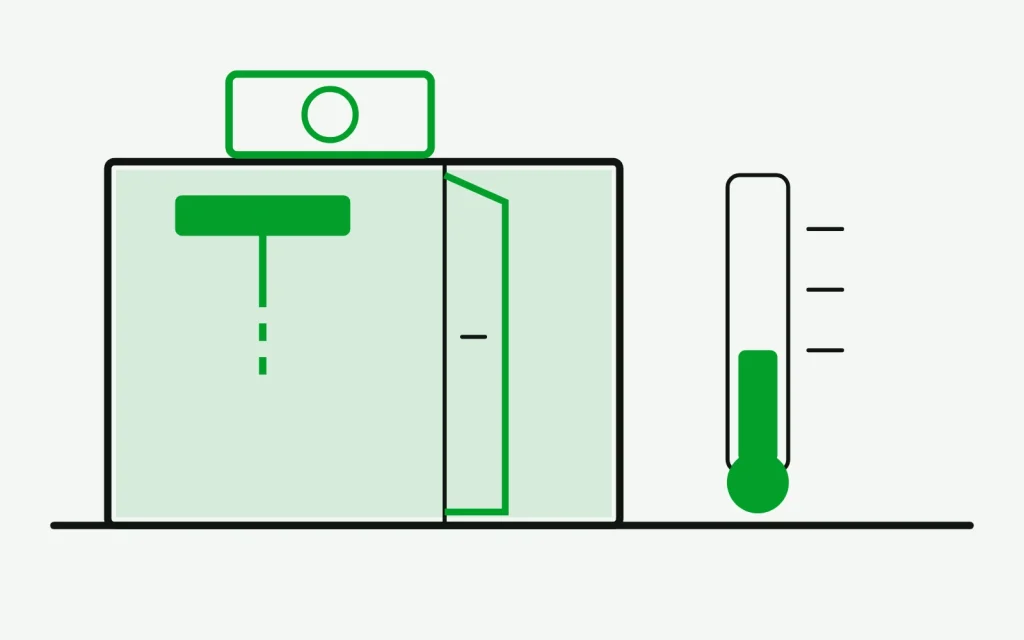 Walk-in cooler in section with the door ajar, an iced evaporator and a thermometer reading high